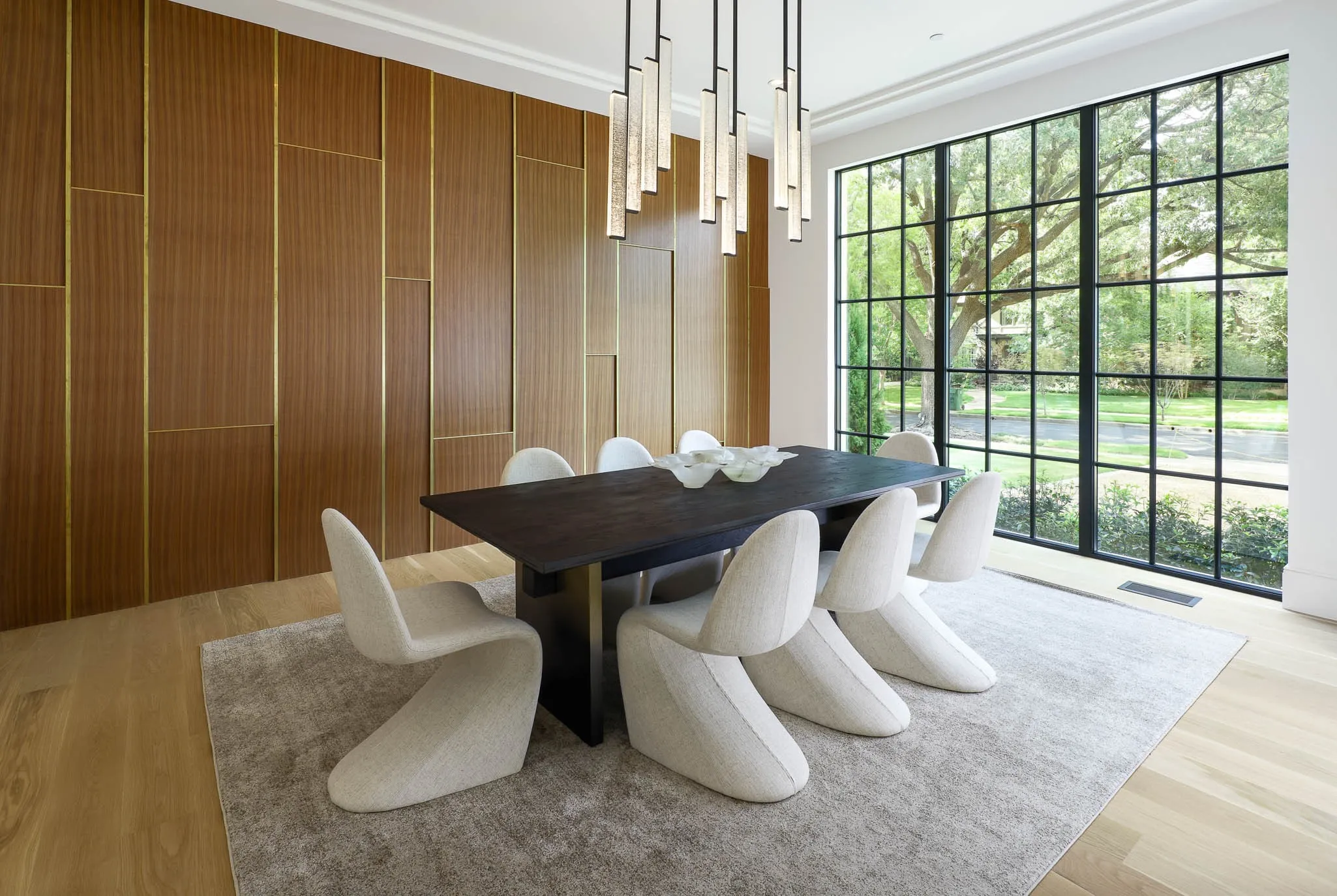 Formal Dining Room with custom paneling and Holly Hunt lighting