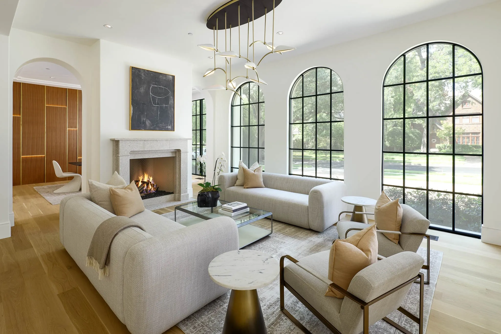 Formal Living Room with gas fireplace and Boyd Spire Leaf Pendant