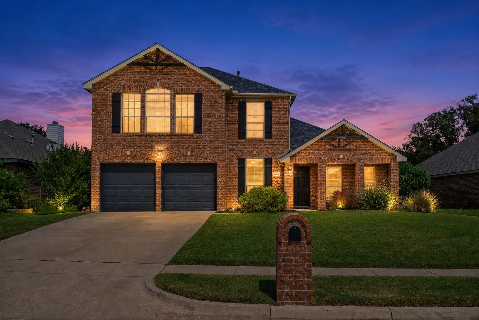 Brick exterior with decorative gables, double-pane windows, and a two-car garage