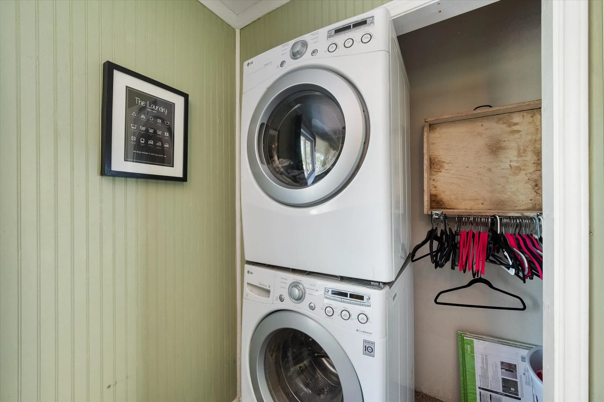 Stackable washer and dryer in a dedicated utility space