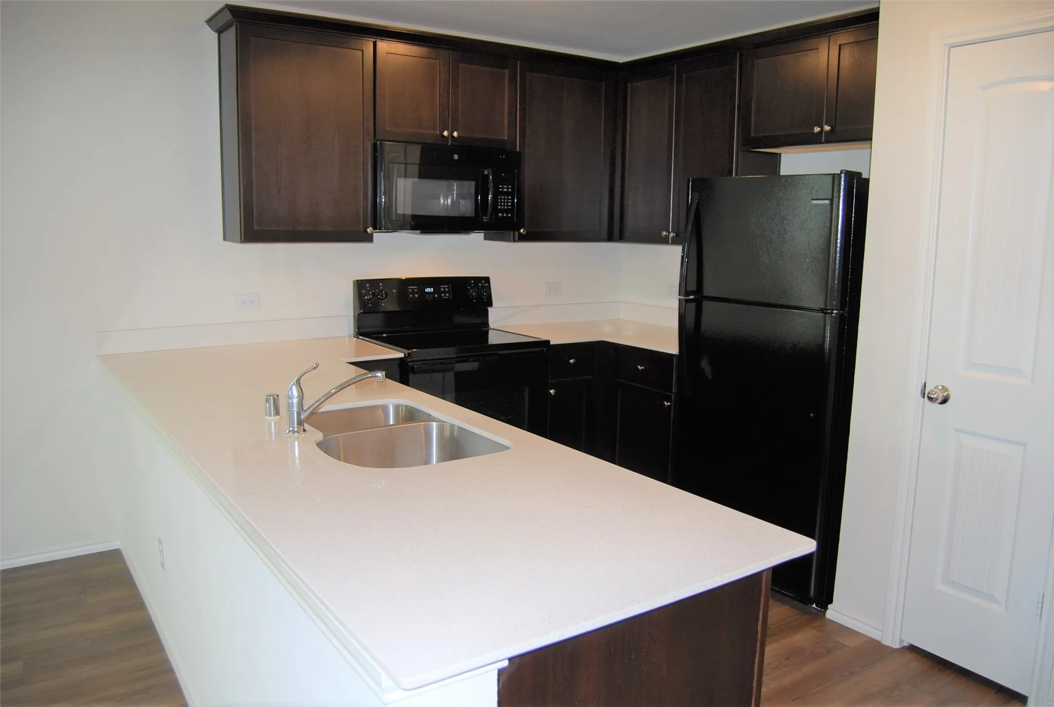 Solid surface countertops with all appliances.