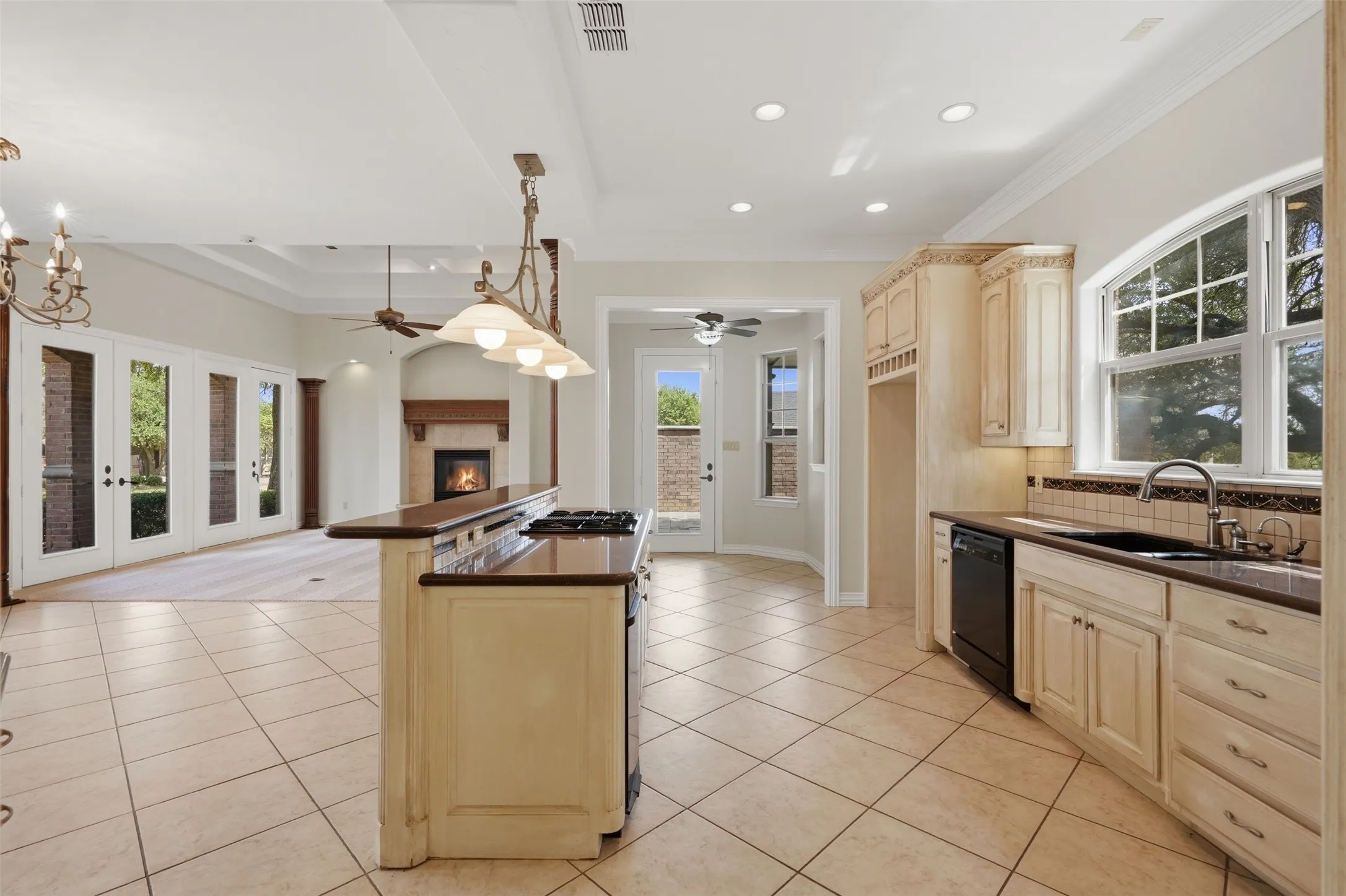 Kitchen features island and built-in desk nook