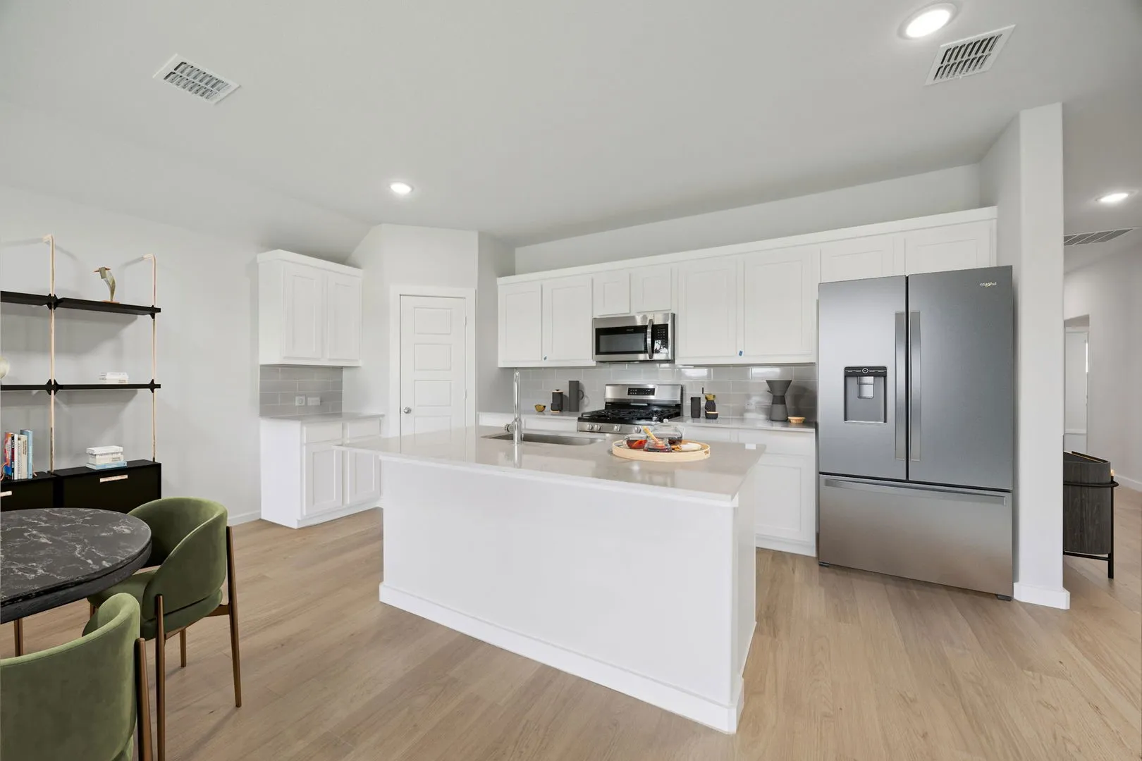 Kitchen in the Hadley home plan by Trophy Signature Homes – REPRESENTATIVE PHOTO