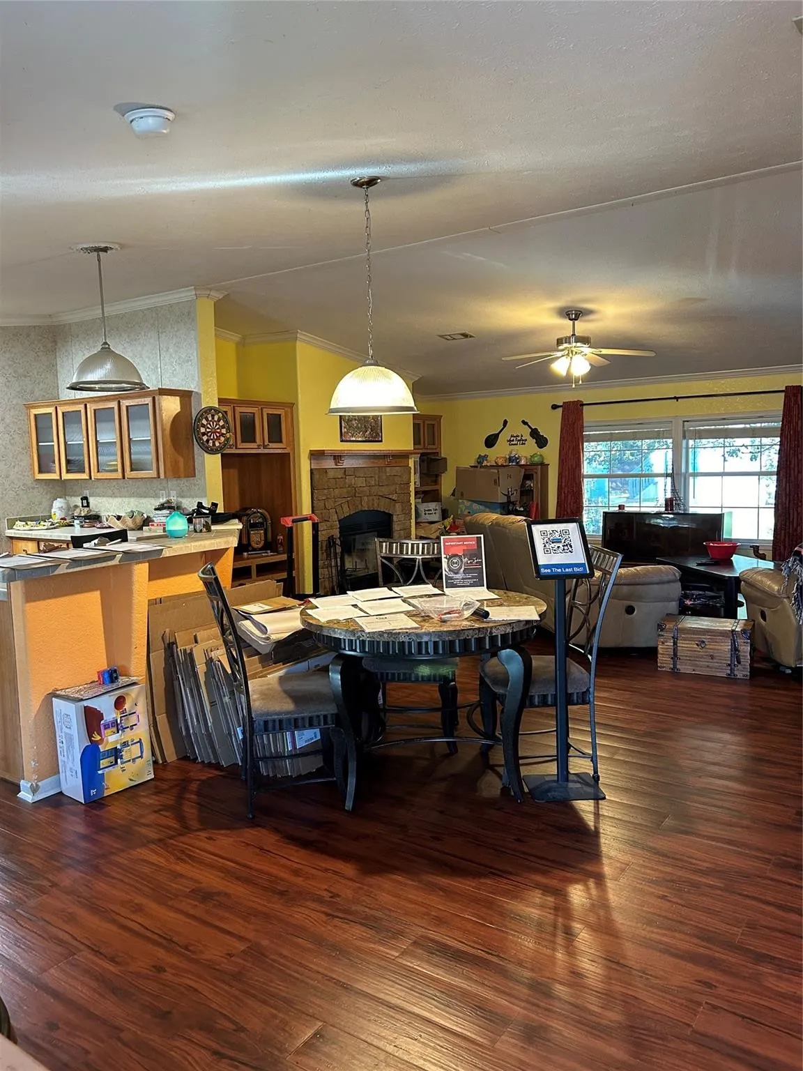 Rich wood-finish flooring throughout the space