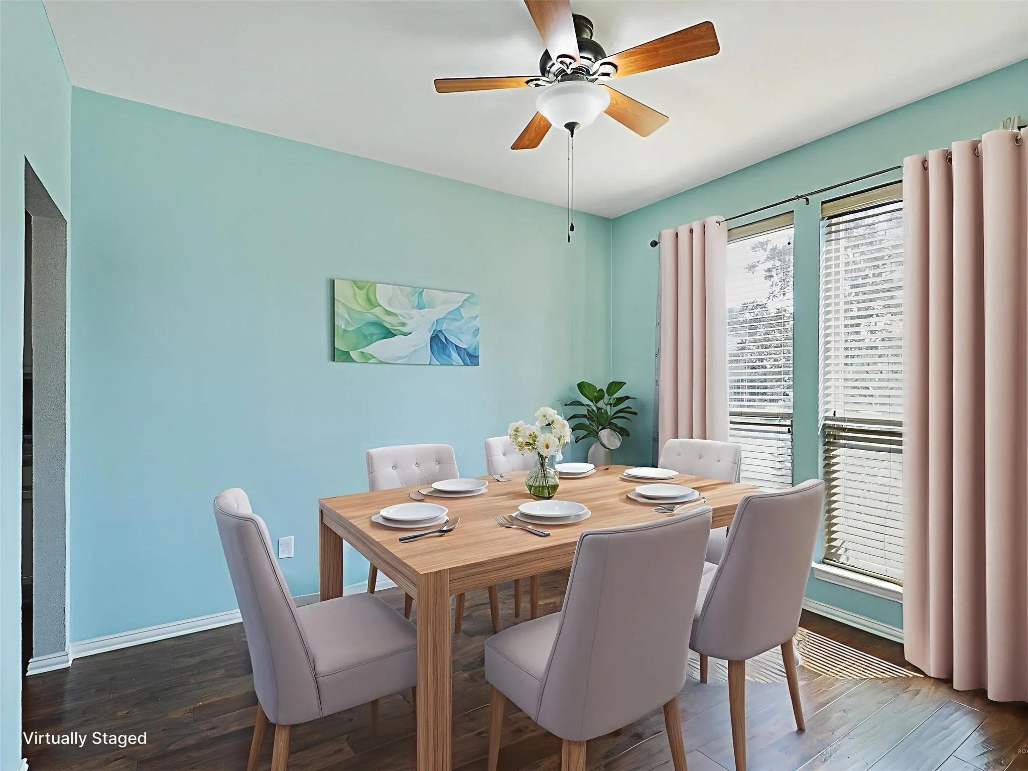 Hardwood-finish flooring, ceiling fan with integrated lighting, and dual windows with blinds