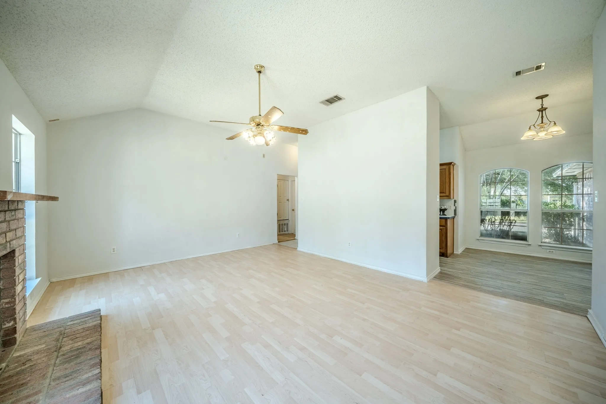 Another view of the spacious living room opening up to the breakfast area.