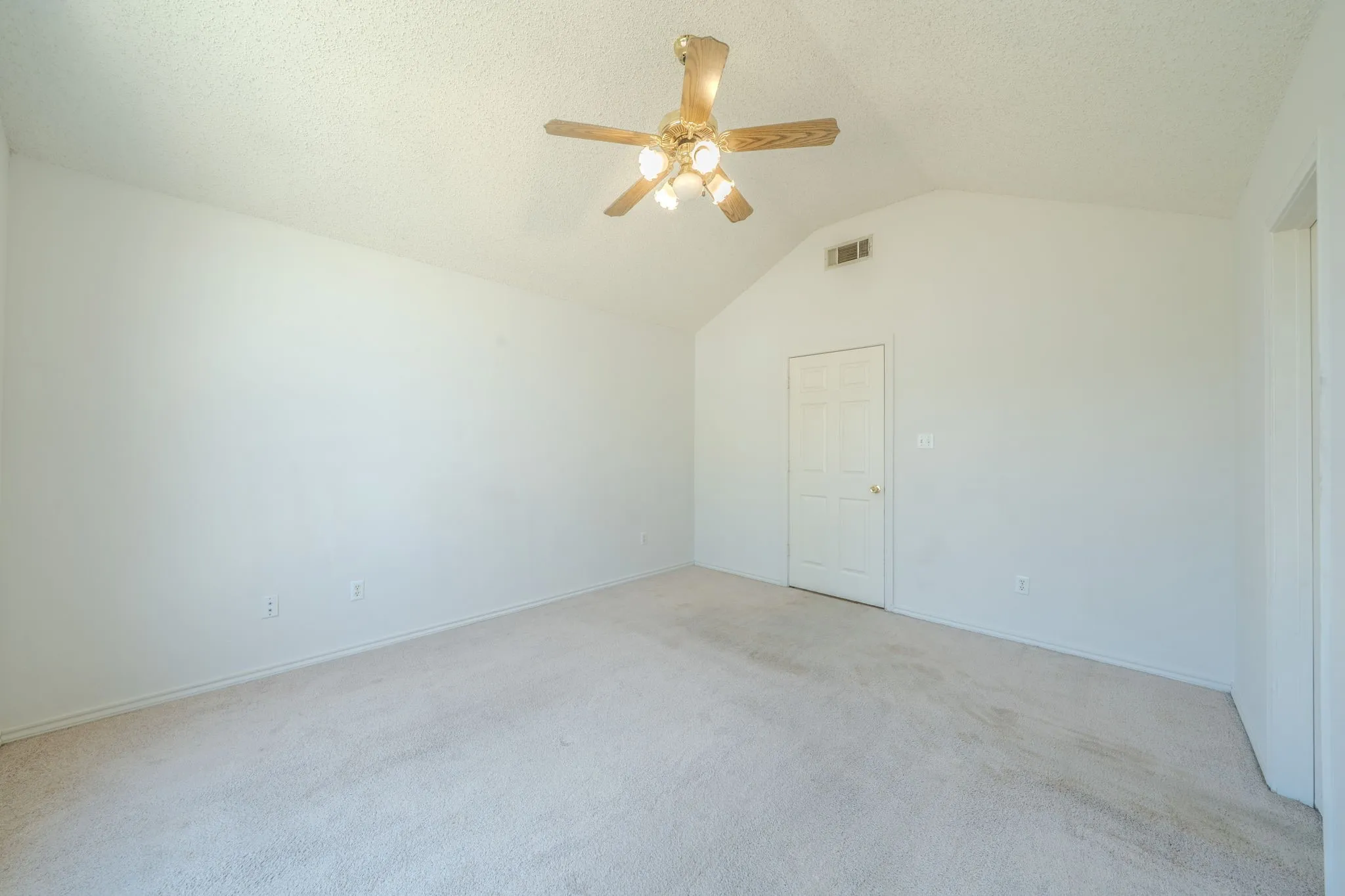 Another view of the primary bedroom.