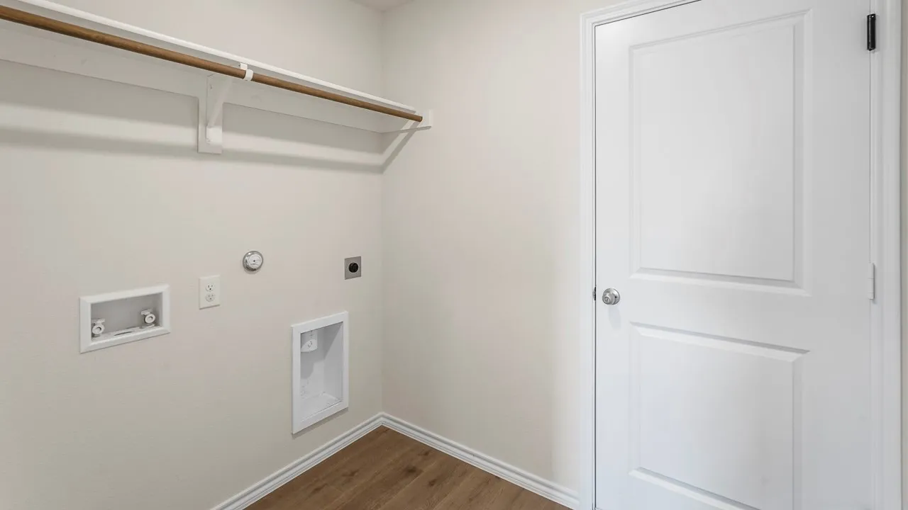 Dedicated utility area featuring wood-finish flooring, a built-in shelf with a hanging rod, and essential appliance hookups