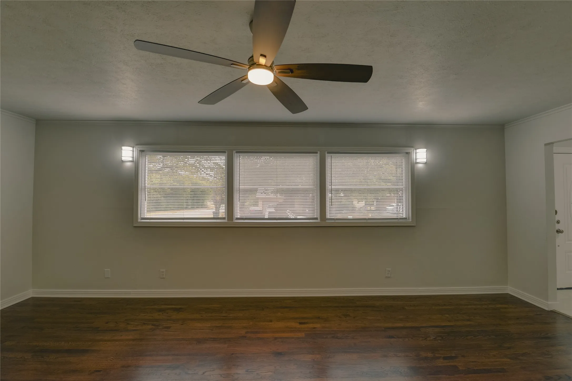 Living room with great view out of the window of the local neighborhood