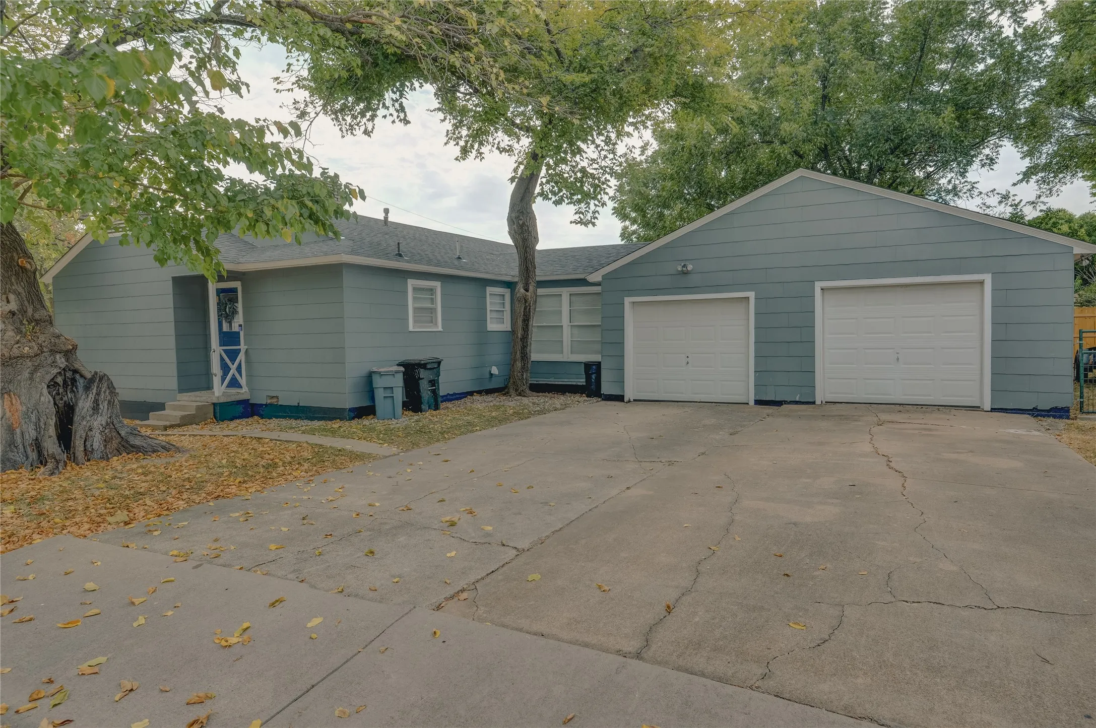 Side of property with side entry and extra parking for a boat or RV