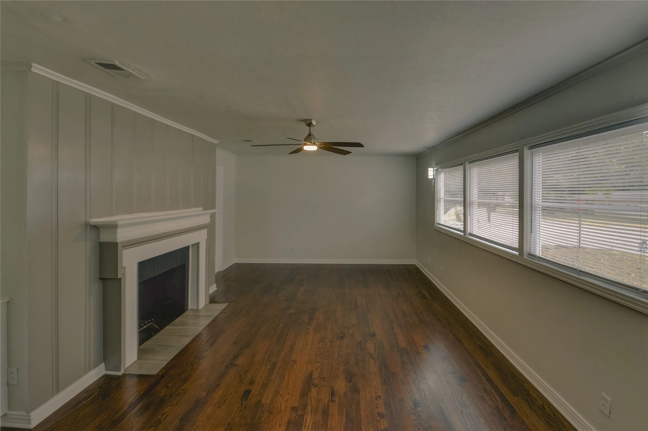 Living room with great windows, lots of light and a perfect place for a couch and dining area.