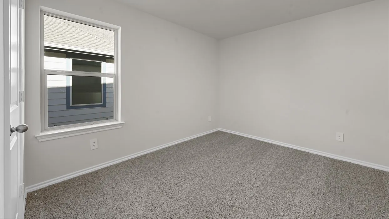 Bright bedroom featuring neutral wall finishes, a large multi-pane window with integrated blinds providing natural light, neutral carpet flooring, and a clean, open layout ideal for flexible furnishing options
