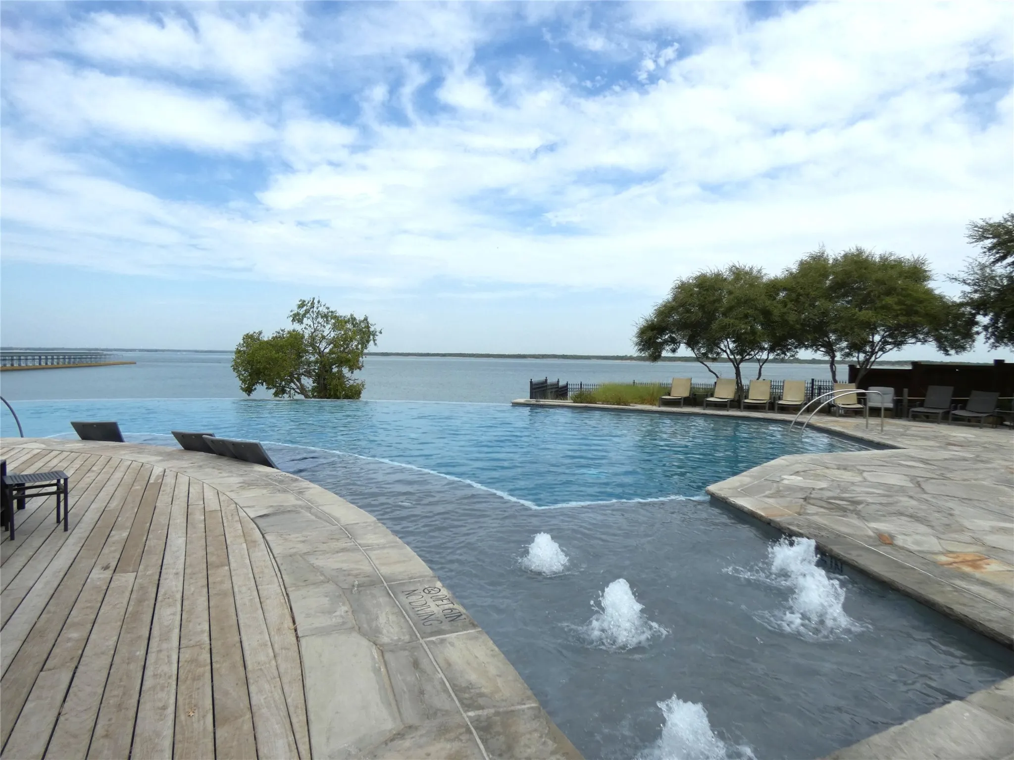 The pool has lots of seating and a great outdoor kitchen with grill stations.