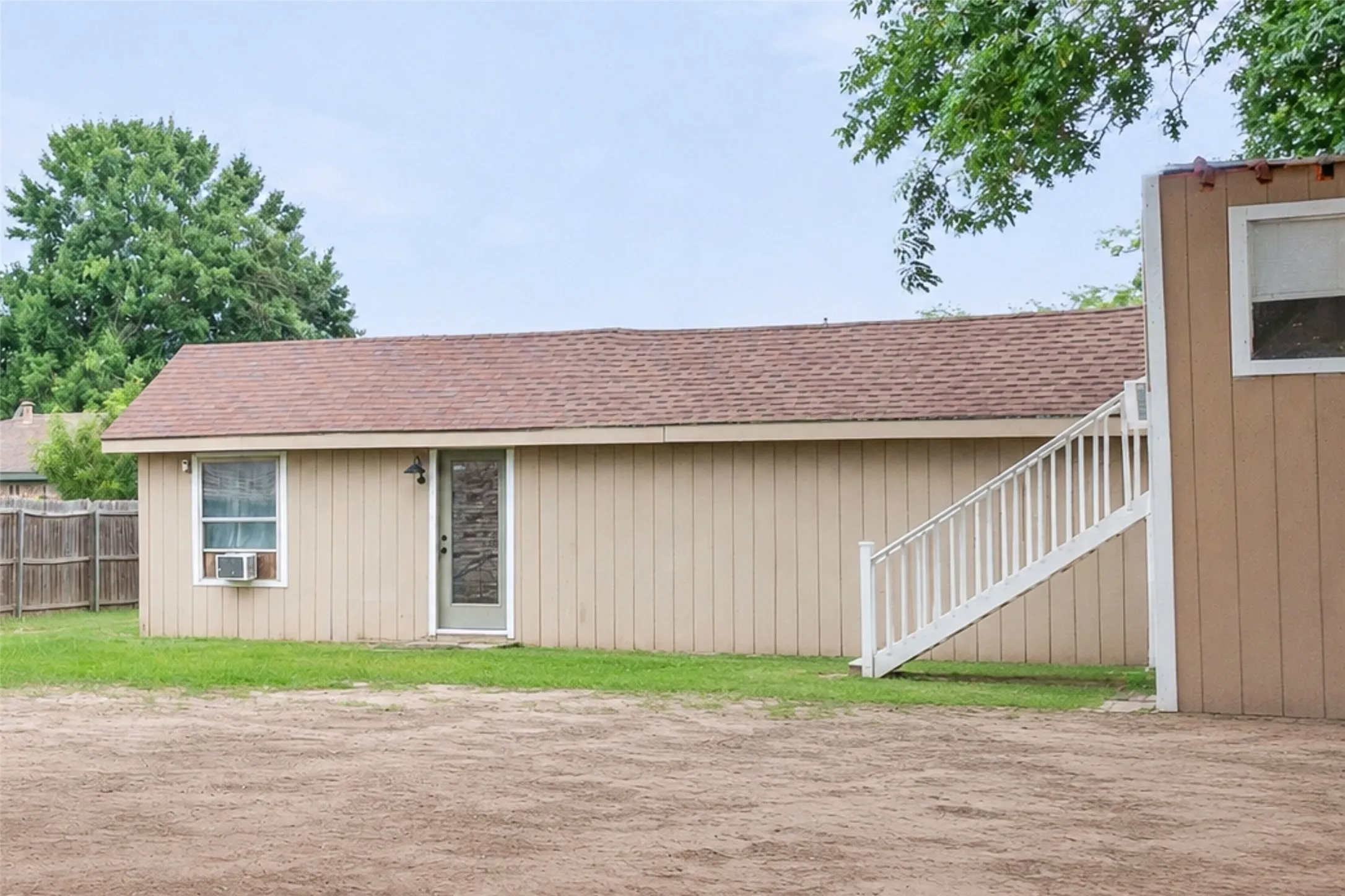 A rare property featuring a 3-bedroom, 2-bath main home, detached apartment, shop, chicken coop, and playhouse. All in one setting.