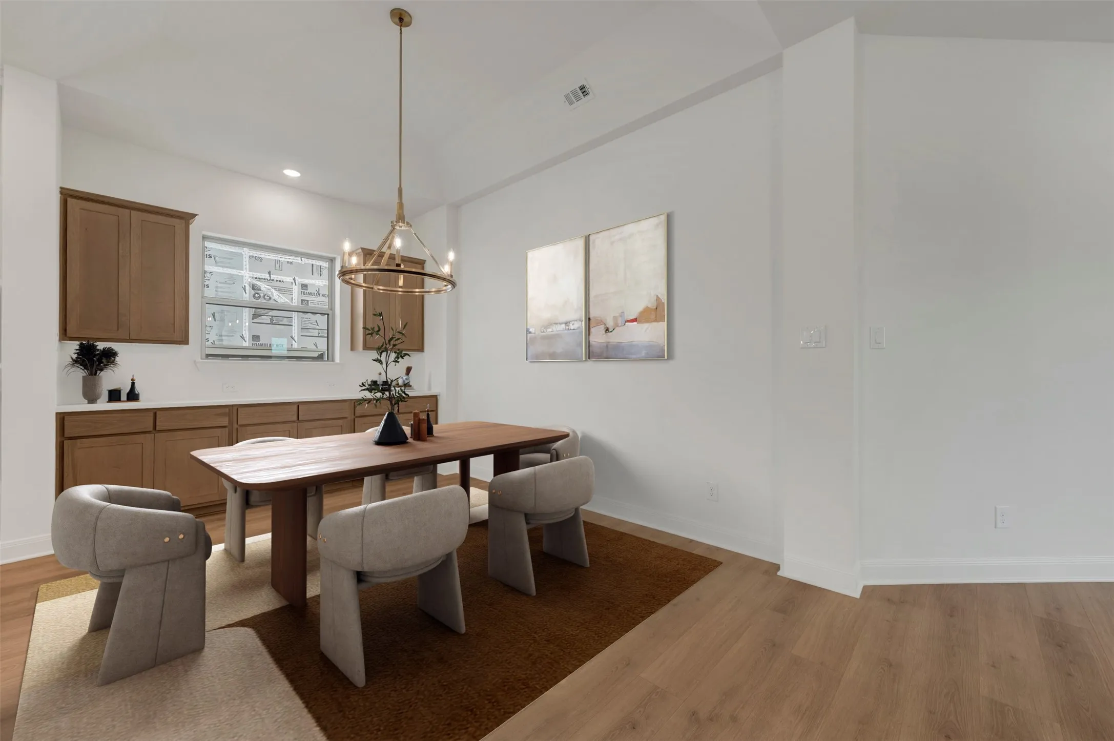 Wood-finish flooring, recessed lighting, and a contemporary chandelier