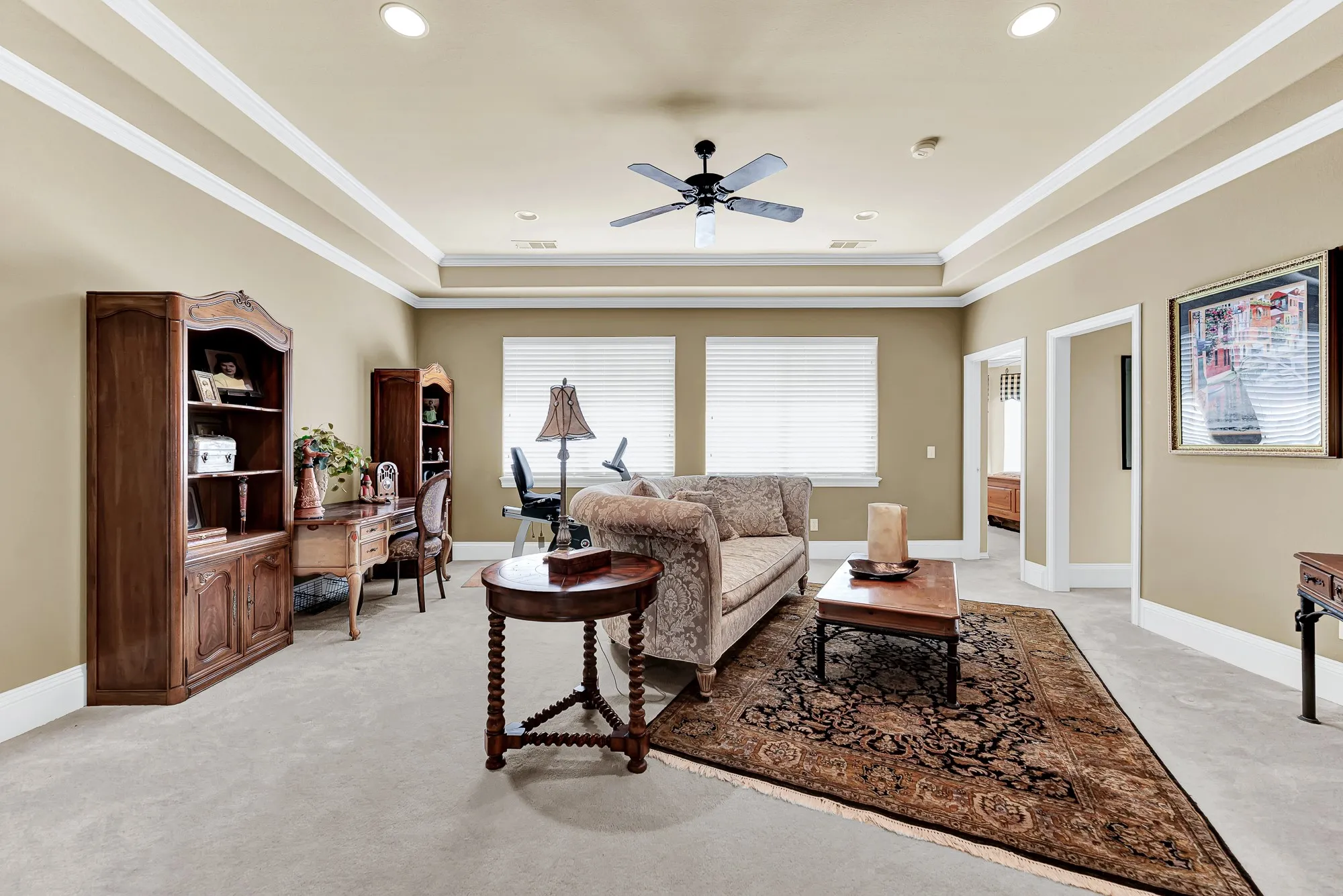 A spacious layout with soft carpeting, recessed lighting, and direct doorways to adjacent bedrooms gives this second-floor game room an open feel. Imagine setting up a cozy lounge area where family members can relax, stream movies, or study comfortably.