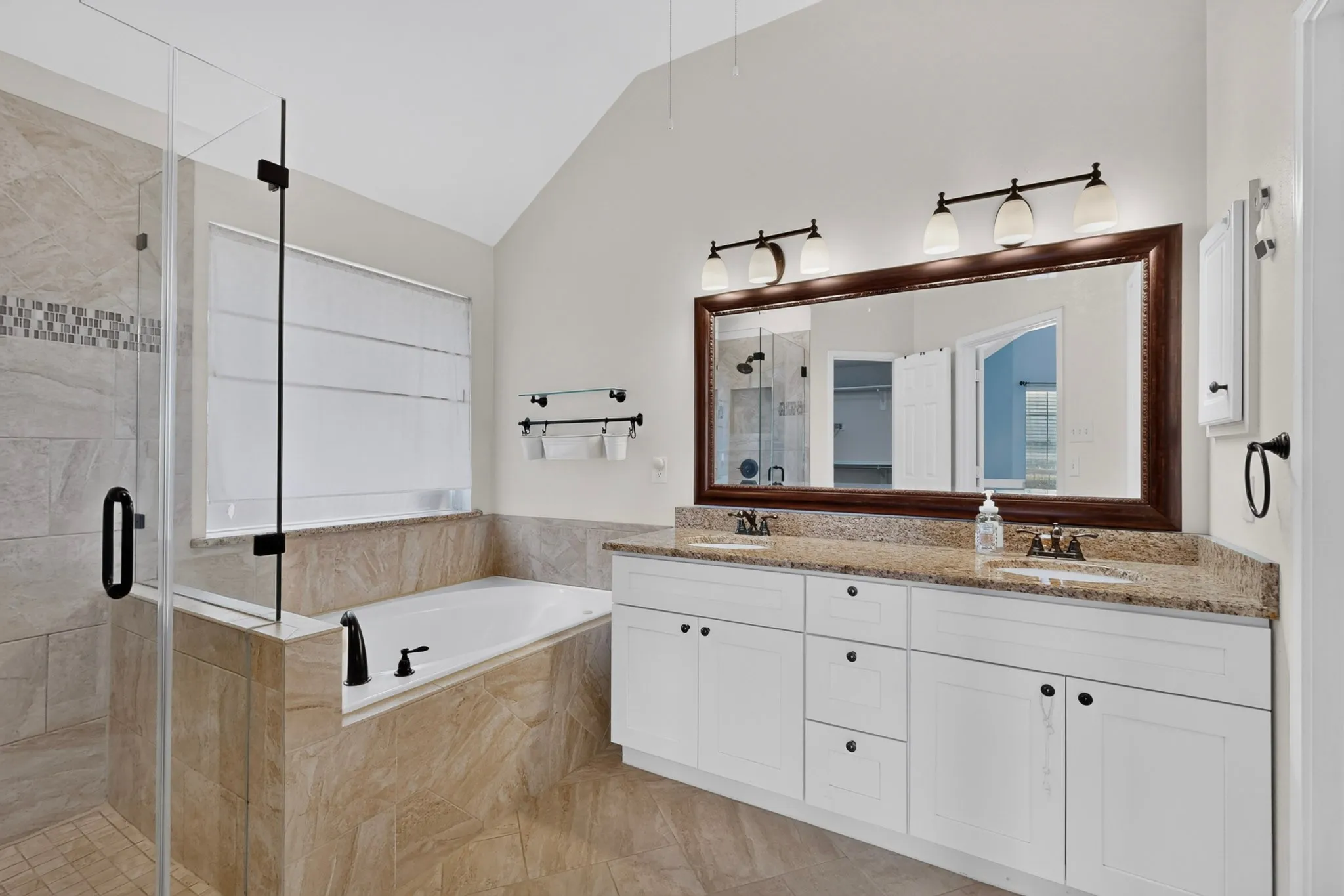 Dual vanity with undermount sinks and light-colored countertops