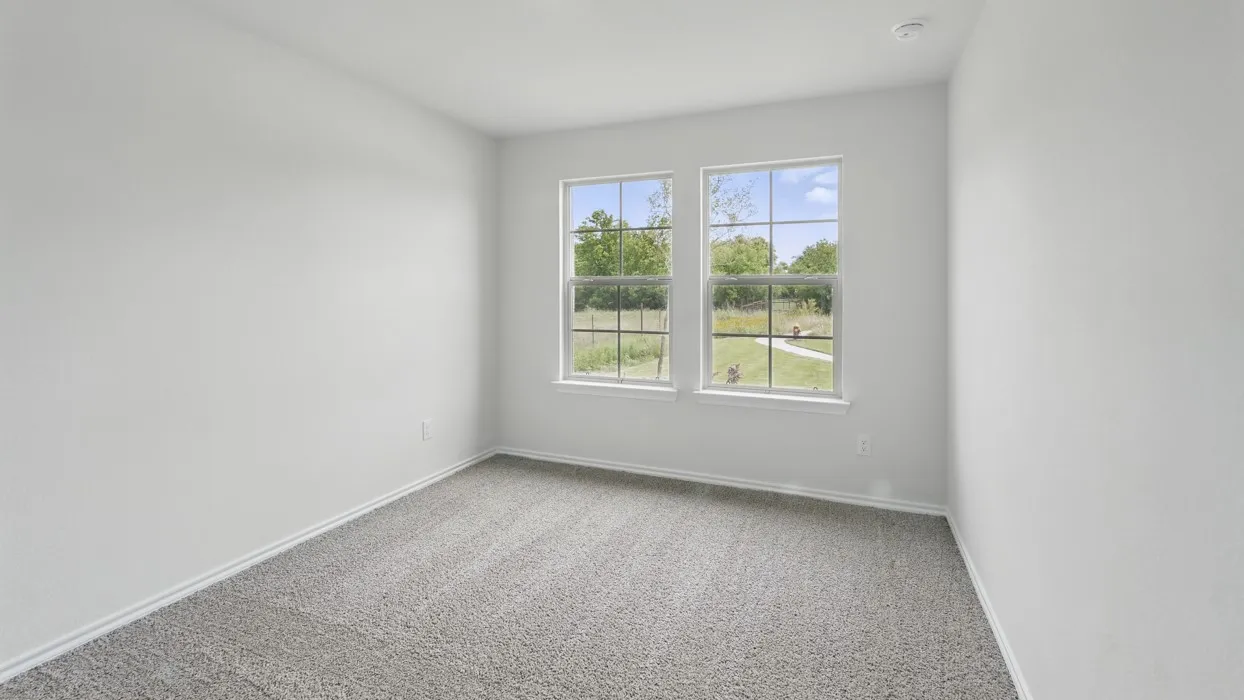 Recessed lighting, light gray carpeting, neutral wall color, and two windows