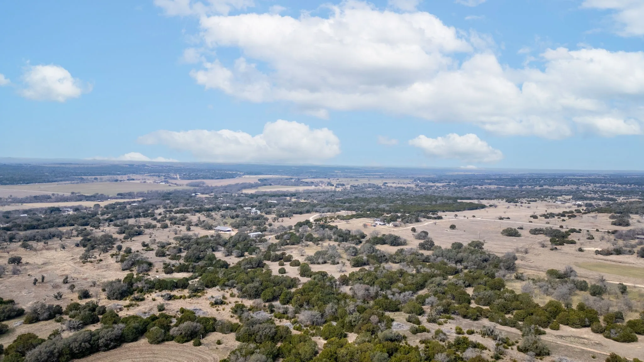 Expansive acreage featuring scattered trees and varied terrain