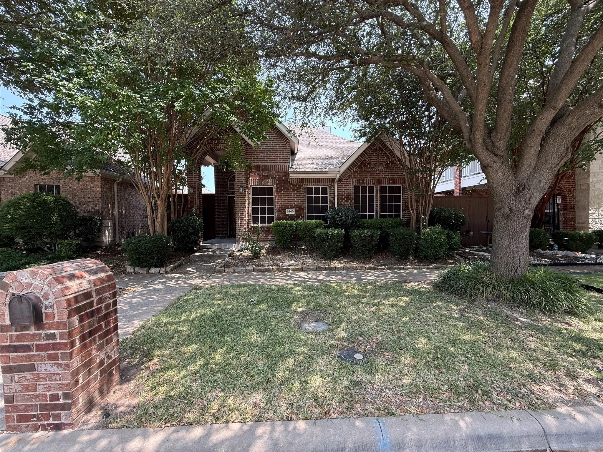 Brick exterior featuring a gabled roofline