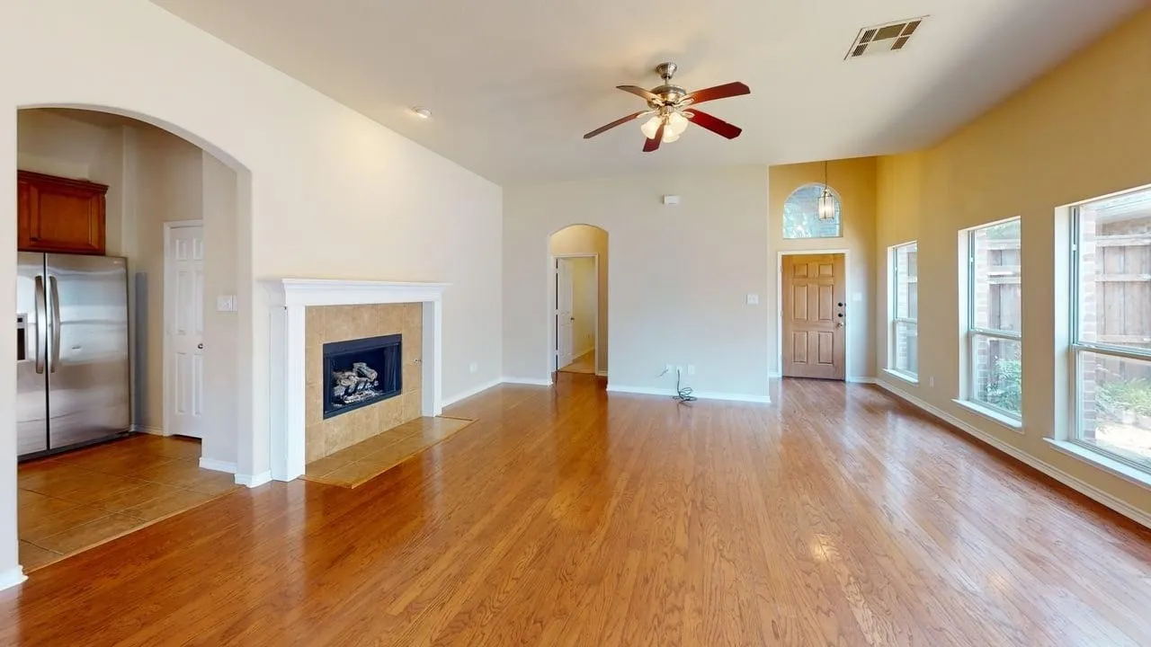 Vaulted ceilings, wood-finish flooring, and arched doorways