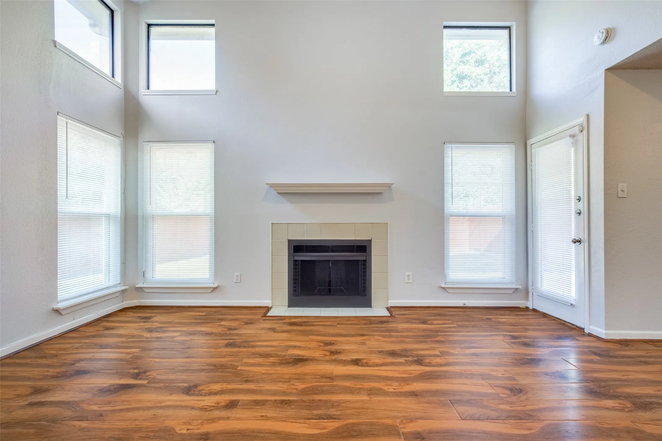 Soaring ceilings with upper transom windows