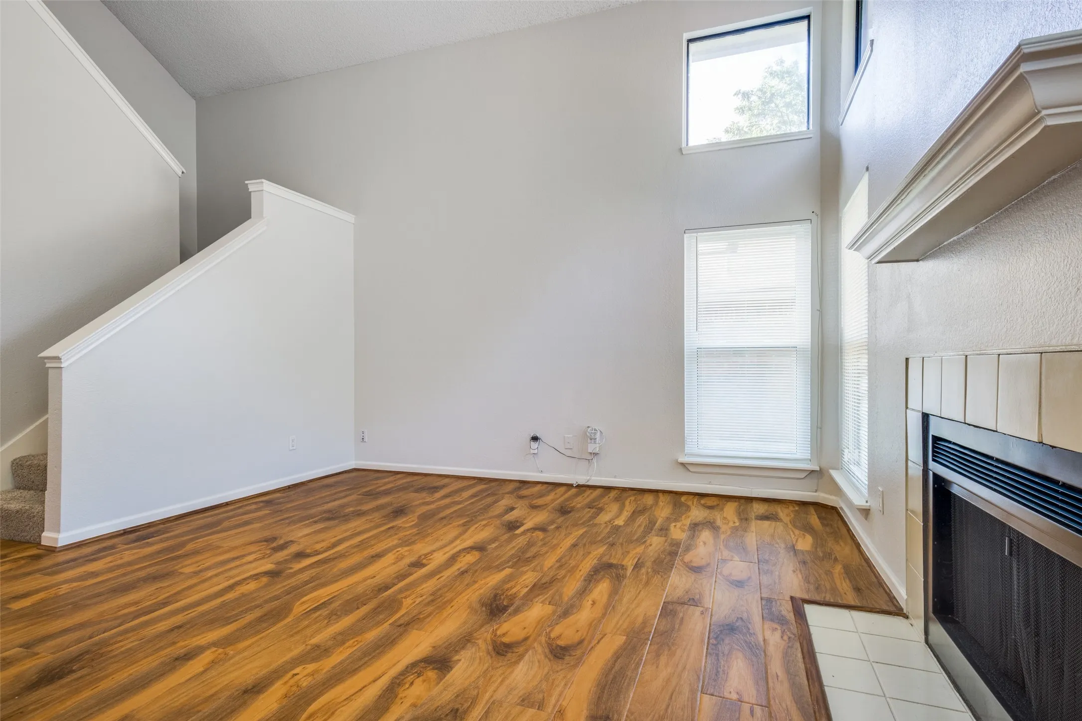 High ceilings complement the wood-finish flooring