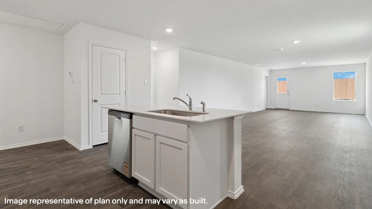 Open-concept living area featuring wood-finish flooring, recessed lighting, a kitchen island with an integrated sink, and stainless steel dishwasher