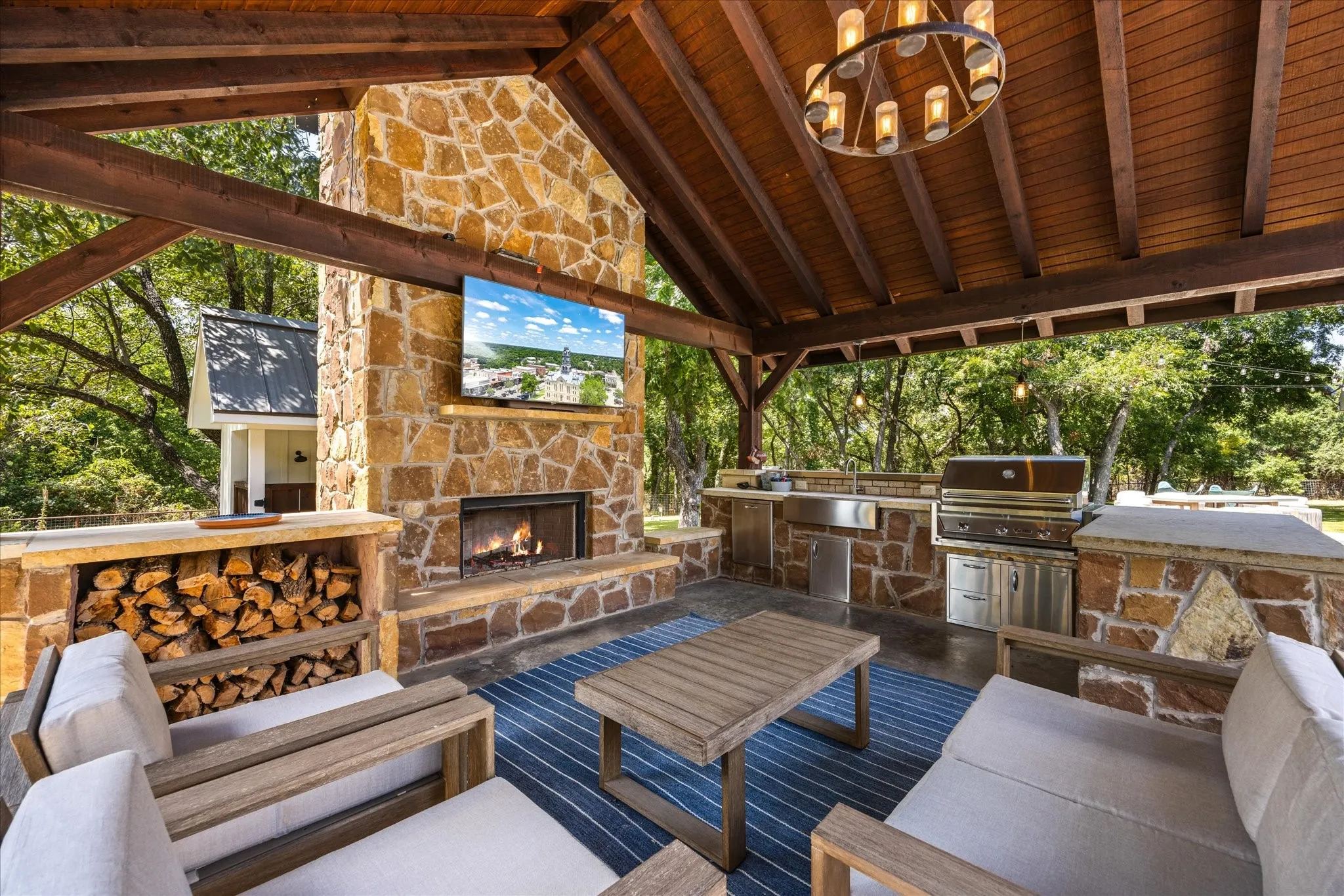 Outdoor living with grill and fireplace