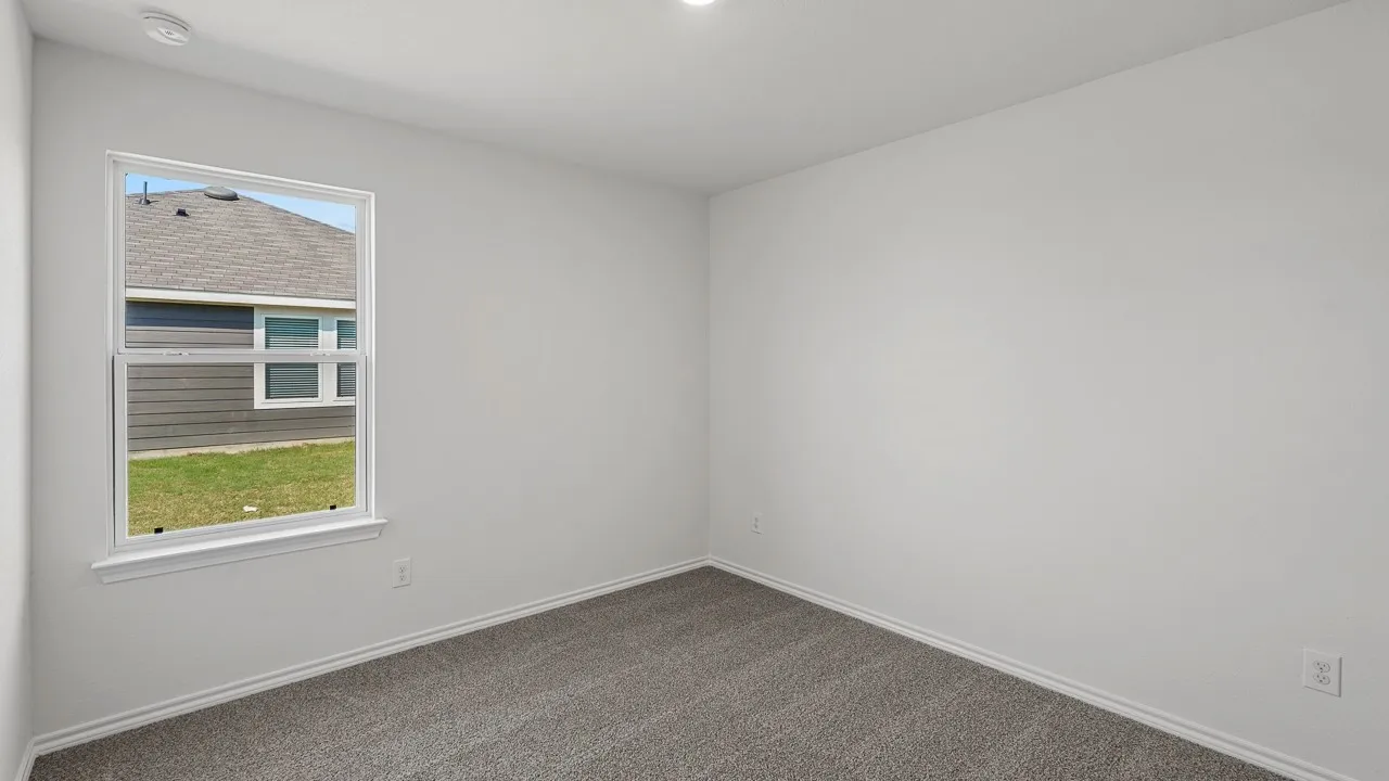 Recessed ceiling lighting, a single window, and neutral wall paint