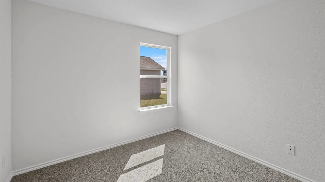 Textured walls with a neutral paint palette, contrasting trim, and carpeted flooring