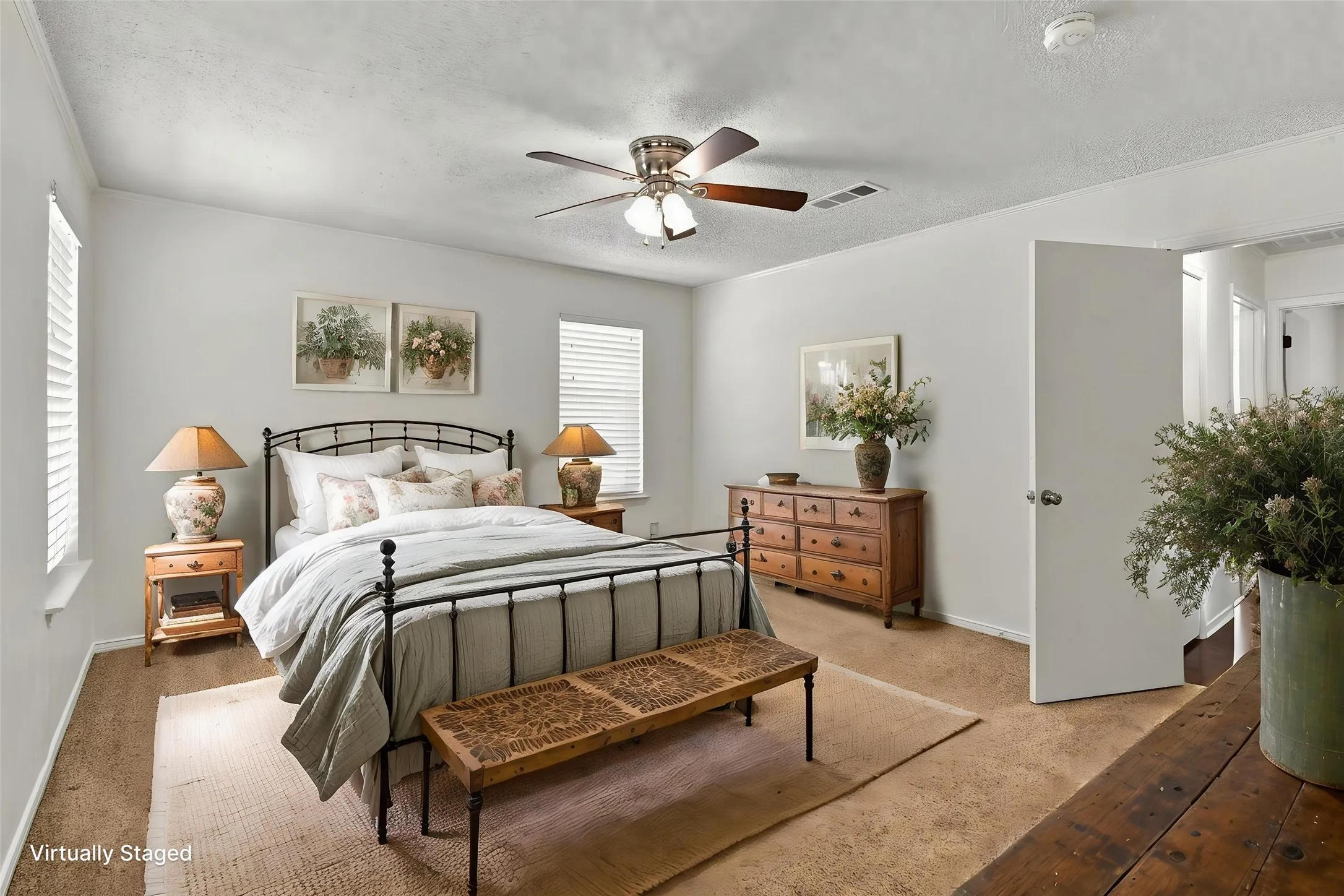 Bedroom with a ceiling fan and ensuite bathroom