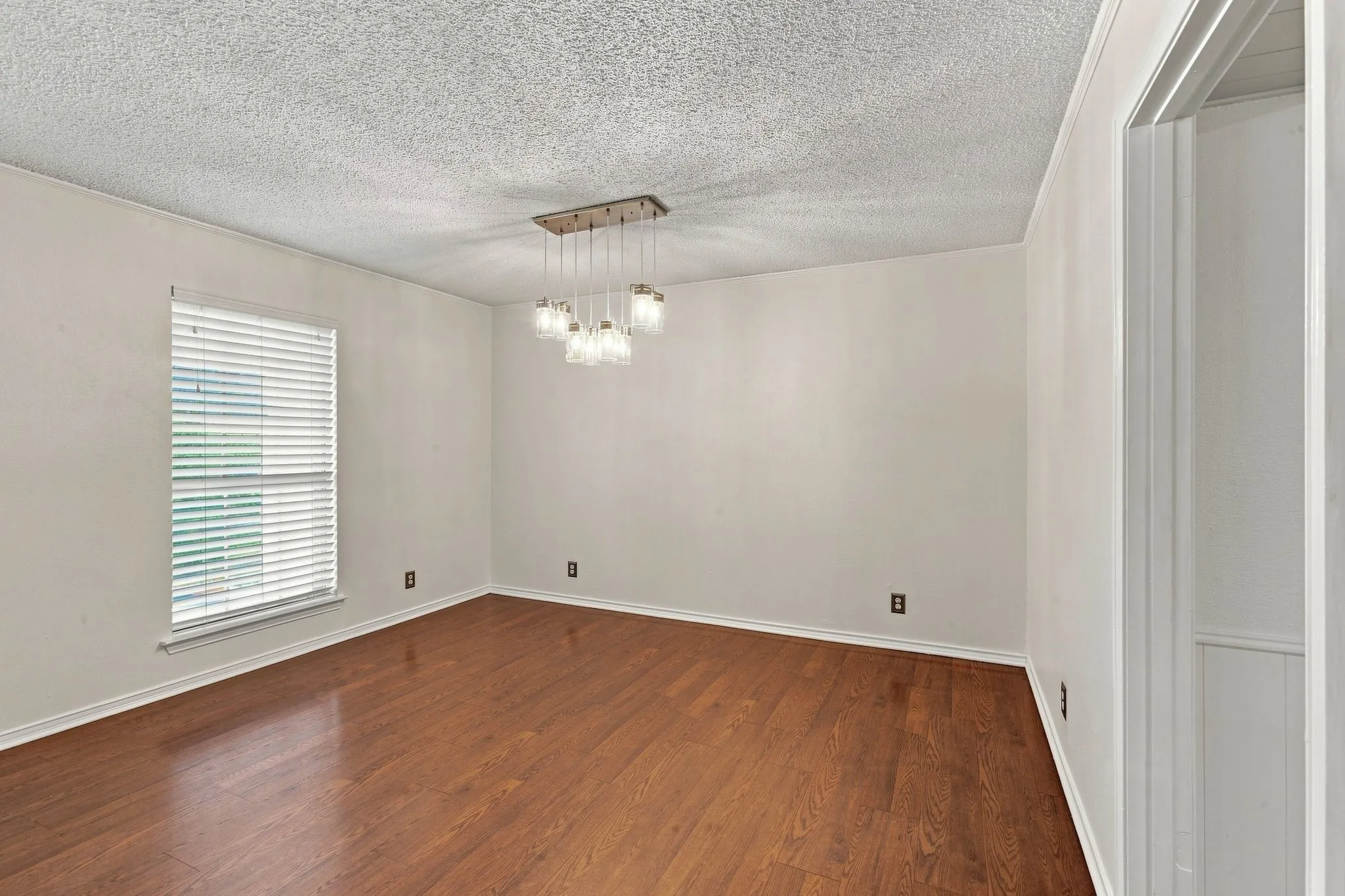 Wood-finish flooring and a multi-pendant lighting fixture