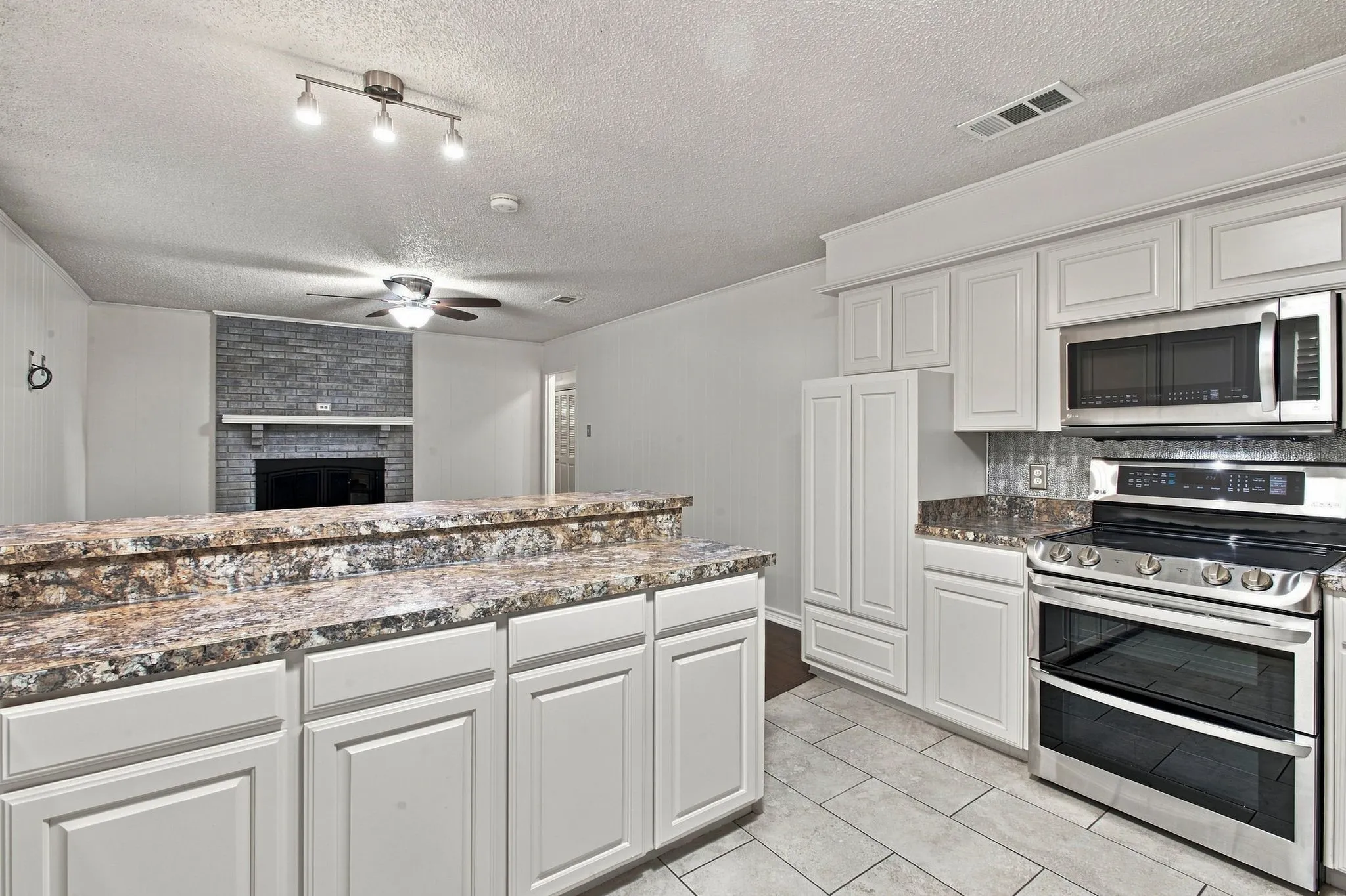 White cabinetry and stainless steel appliances