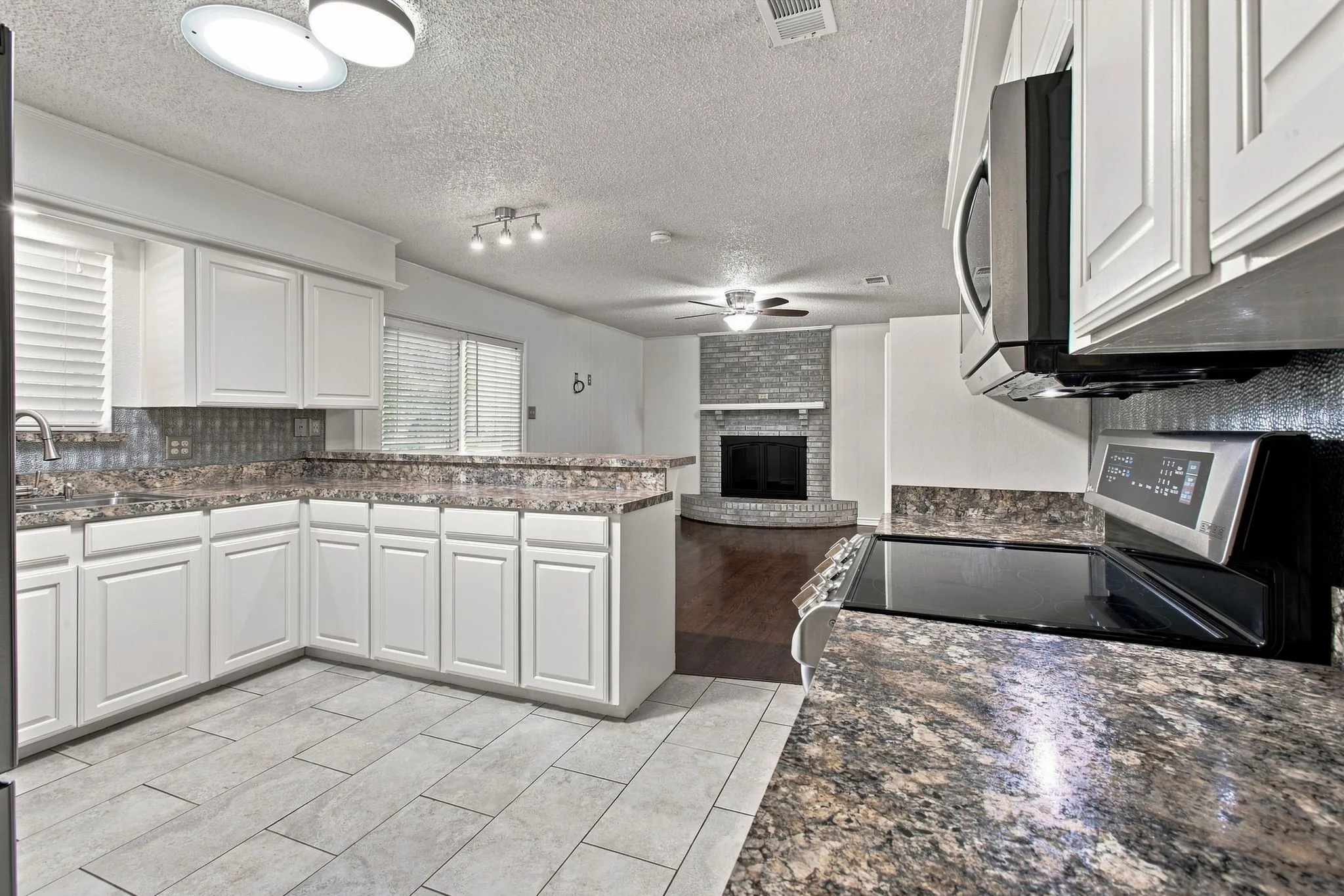White cabinetry and stainless steel appliances