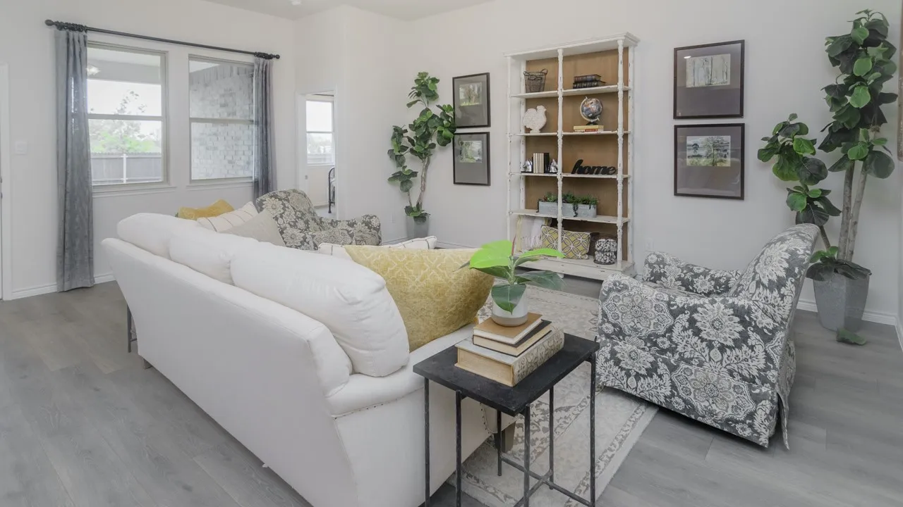 Wood-finish flooring, white walls, and a built-in shelving unit