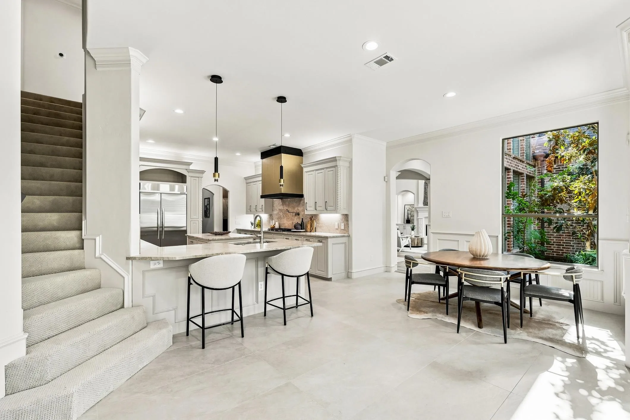 secondary dining area for those morning coffees and relax and enjoy the view of the luch and professionally landscaped backyard