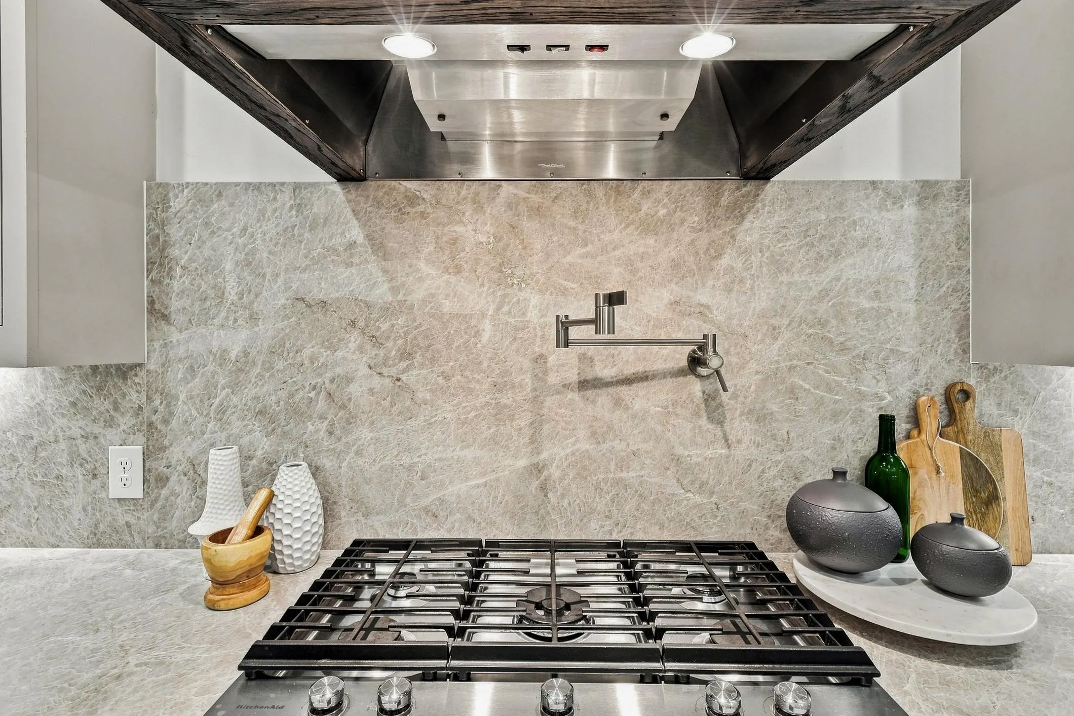 Kitchen Aid 5 burner gas cook top with pot filler and quartz back splash