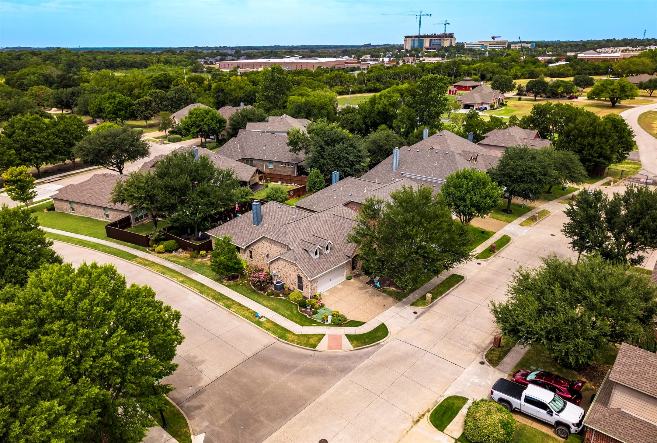 Stone and brick exterior residence with an attached garage, situated on a corner lot