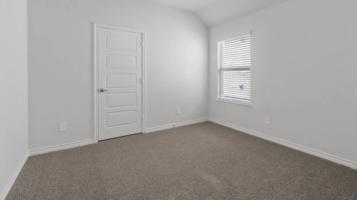 Neutral color palette, carpeted flooring, white trim, window with blinds, and a five-panel interior door