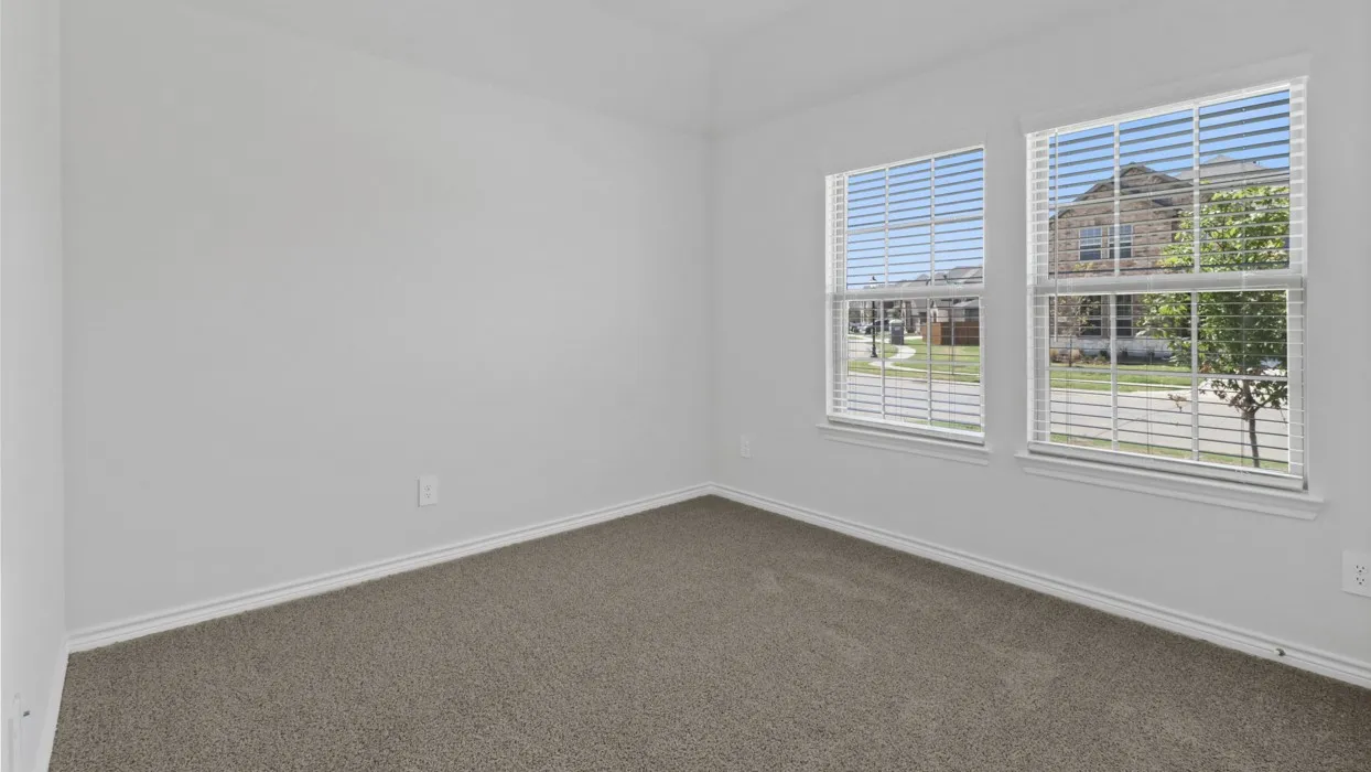 Neutral tone wall paint with two windows, horizontal blinds, and carpeting