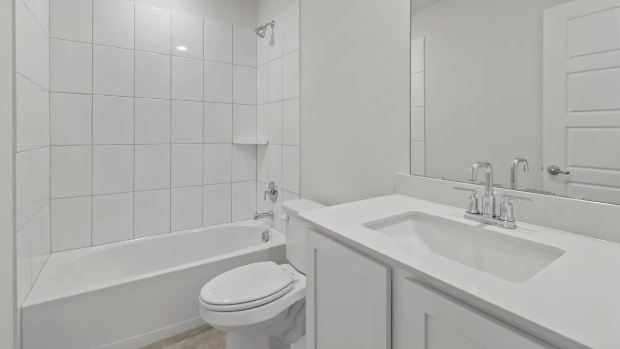 White subway tile shower surround with integrated shelf