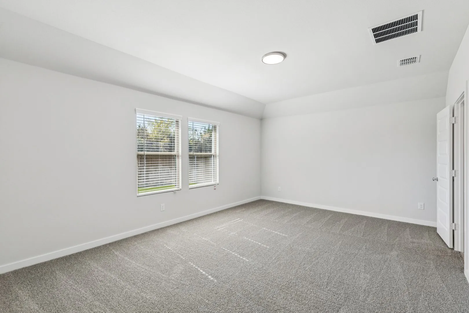 Primary Suite in the Oscar home plan by Trophy Signature Homes – REPRESENTATIVE PHOTO