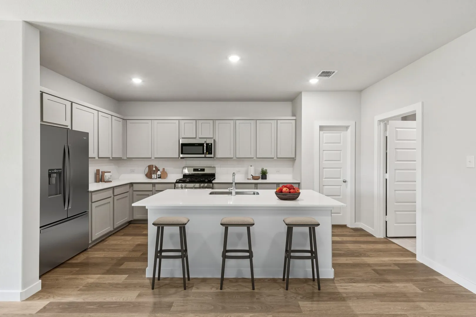 Kitchen in the Oscar home plan by Trophy Signature Homes – REPRESENTATIVE PHOTO