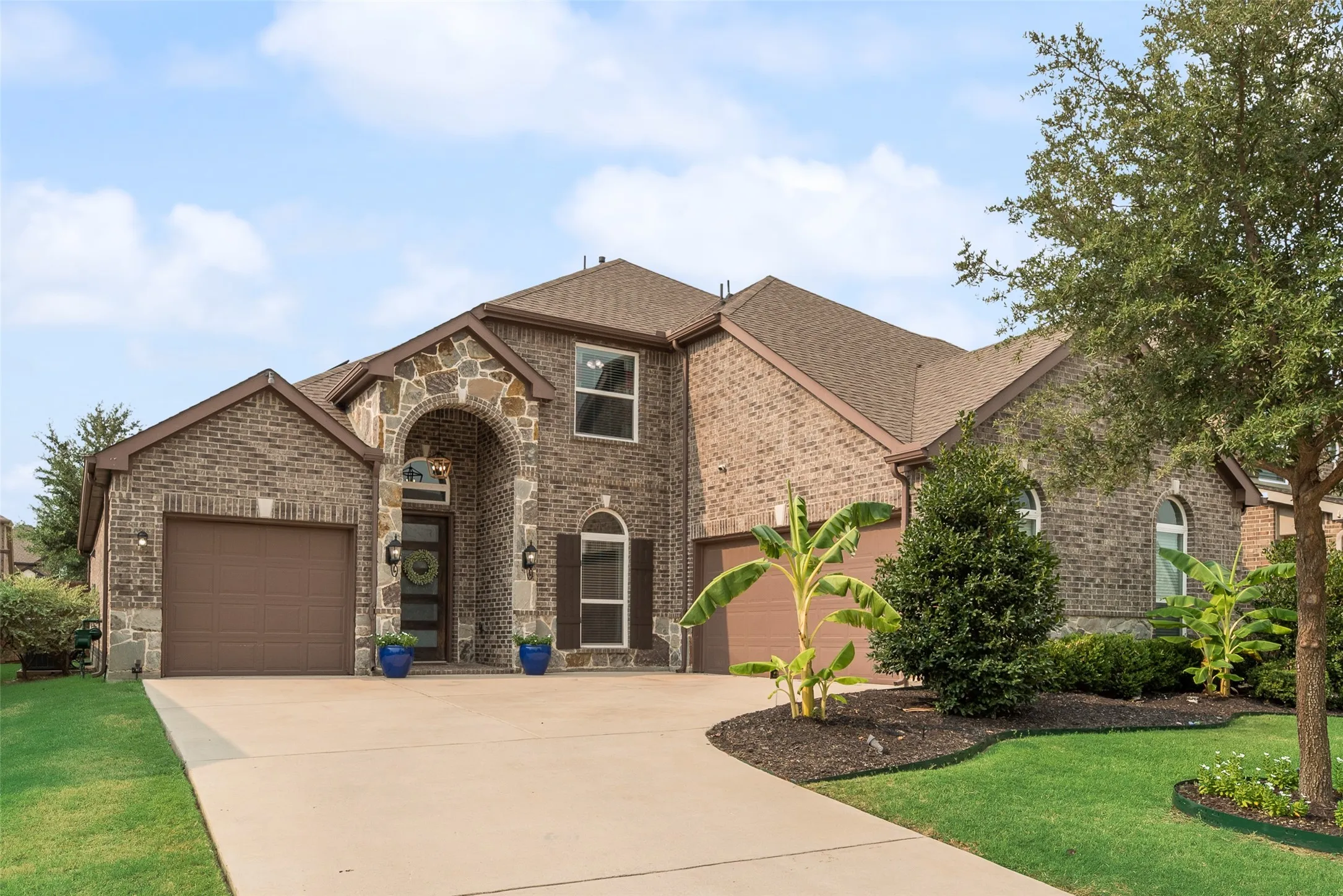 Stone and brick two story home.
