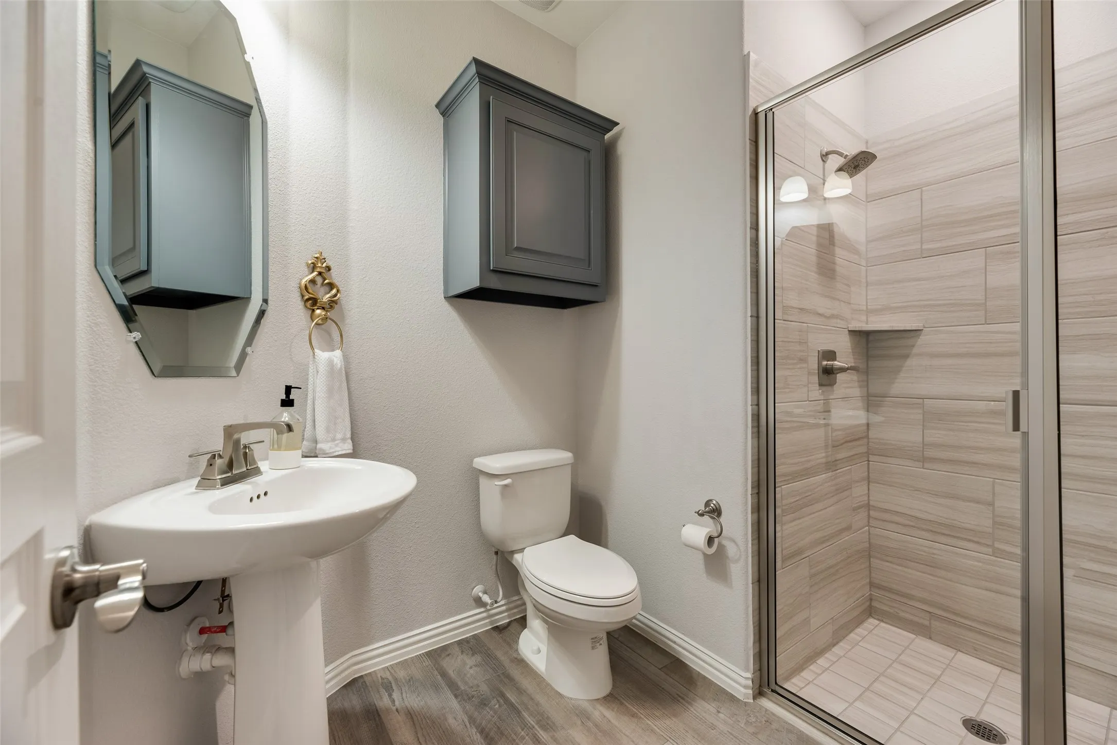 Downstairs full bath is adjacent to media room and office