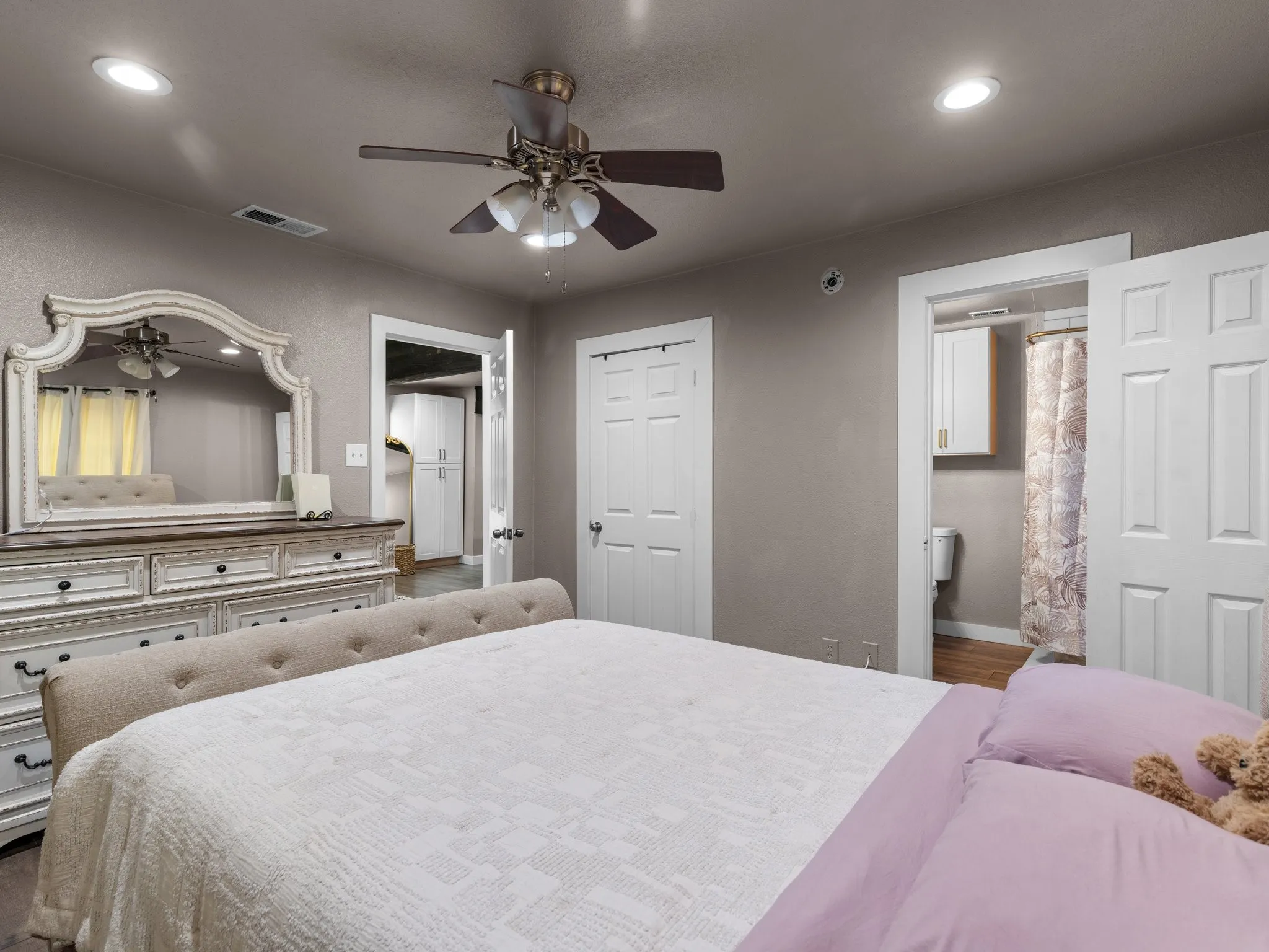 Recessed ceiling lighting, ceiling fan, and painted interior doors