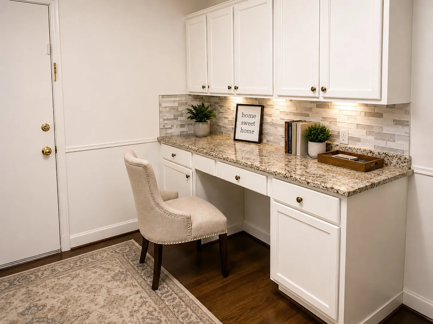 KITCHEN WORKSTATION: A convenient built-in desk with abundant cabinetry and counter space creates the perfect spot for a home command center, computer station, mail organization or everyday planning—all conveniently located within the kitchen. Virtually staged.