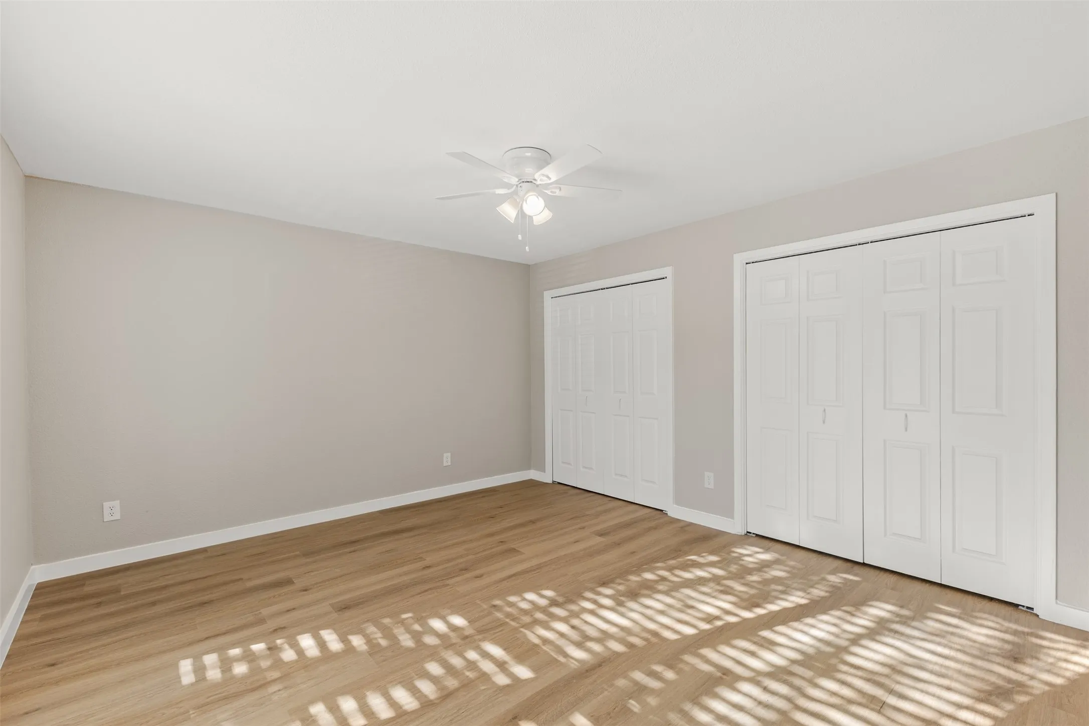 Wood-finish flooring with light neutral wall tones