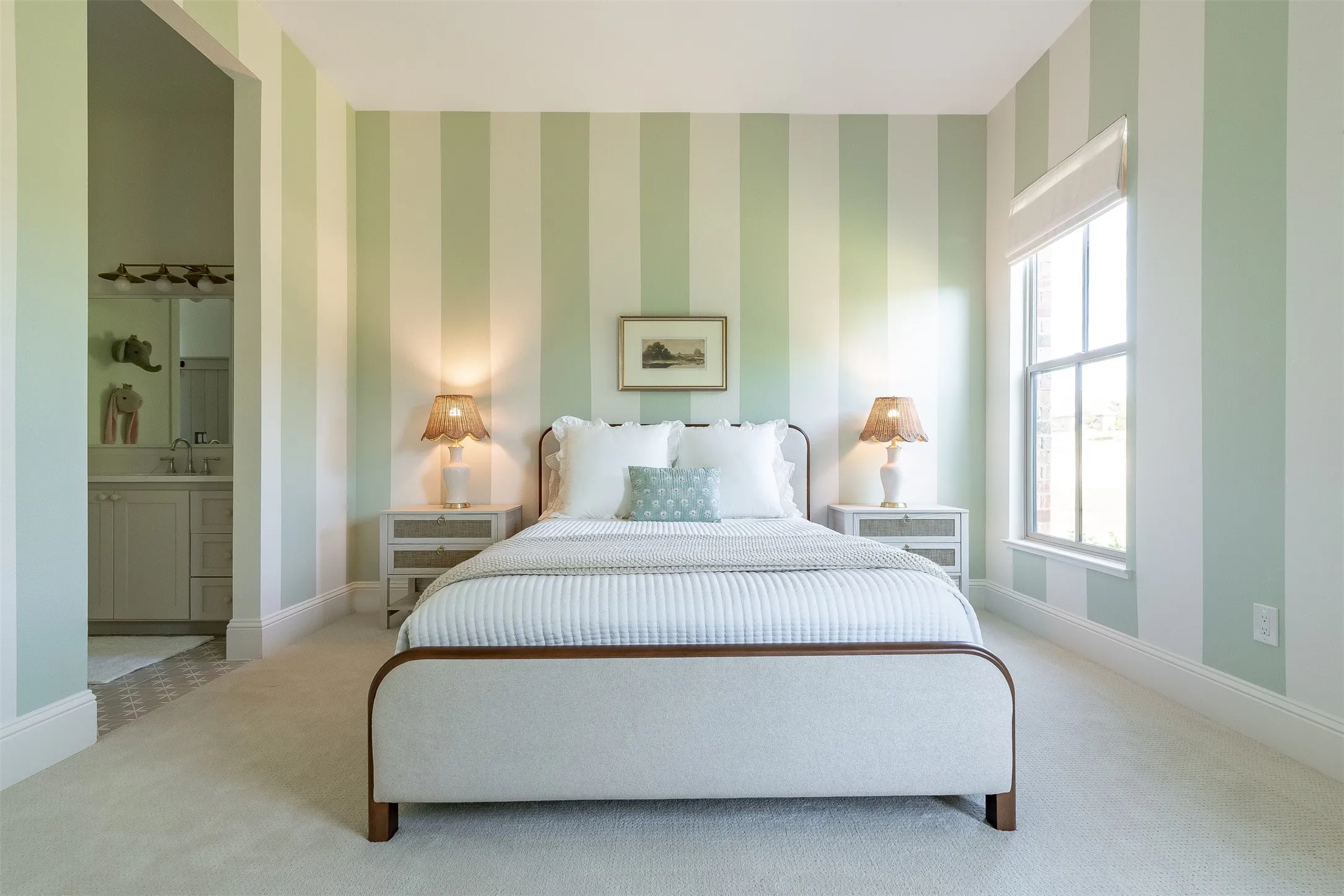 Light-toned striped wall treatment with a large window, complemented by plush carpeting
